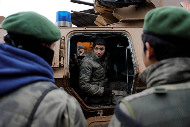 Turkey-backed Free Syrian Army police forces  escort a convoy near Azaz