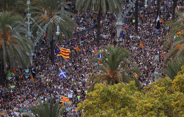 People attend a pro-indpendence rally near the Catalan regional parliament in Barcelona