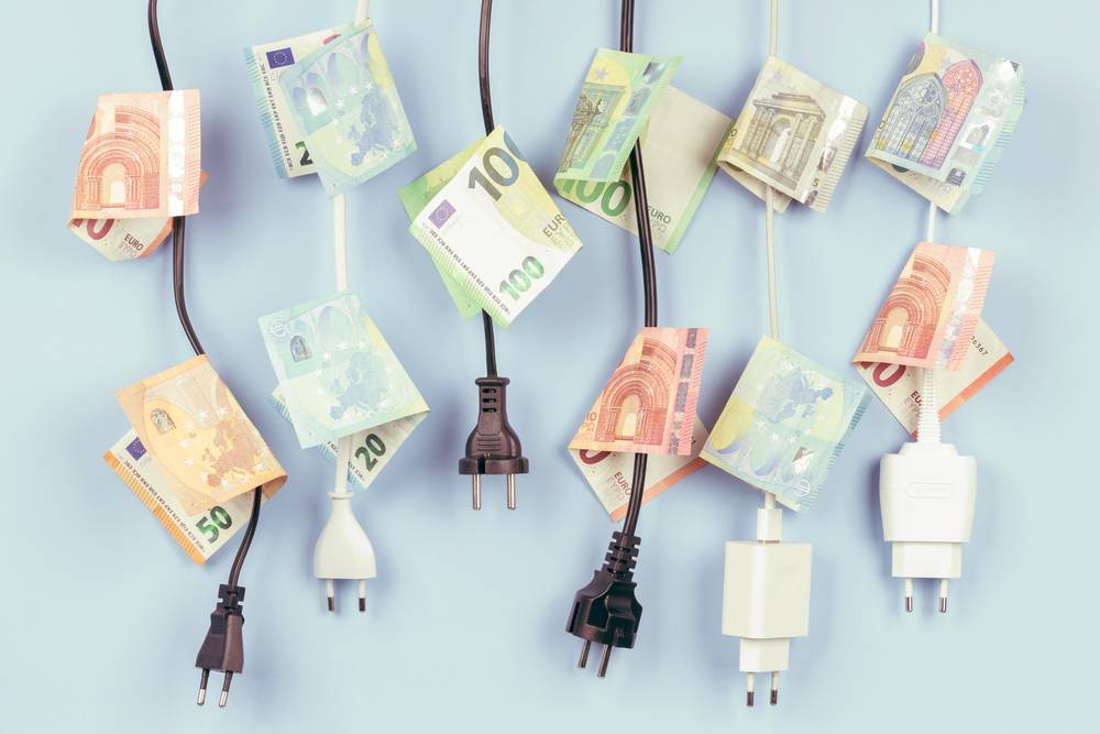 Electric,Power,Plugs,With,Euro,Banknotes,On,Them,Hanging,On