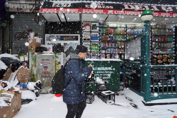 A pedestrian walks past Sal Express Deli & Grocery, in Brooklyn