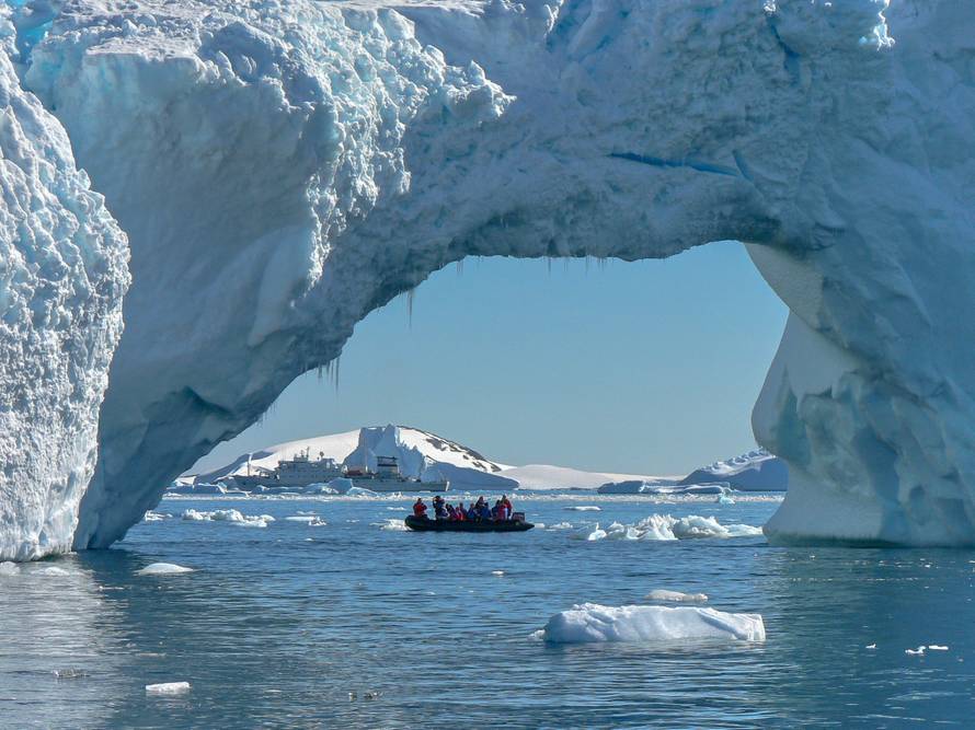 Large ice arch in iceberg in Antarctica