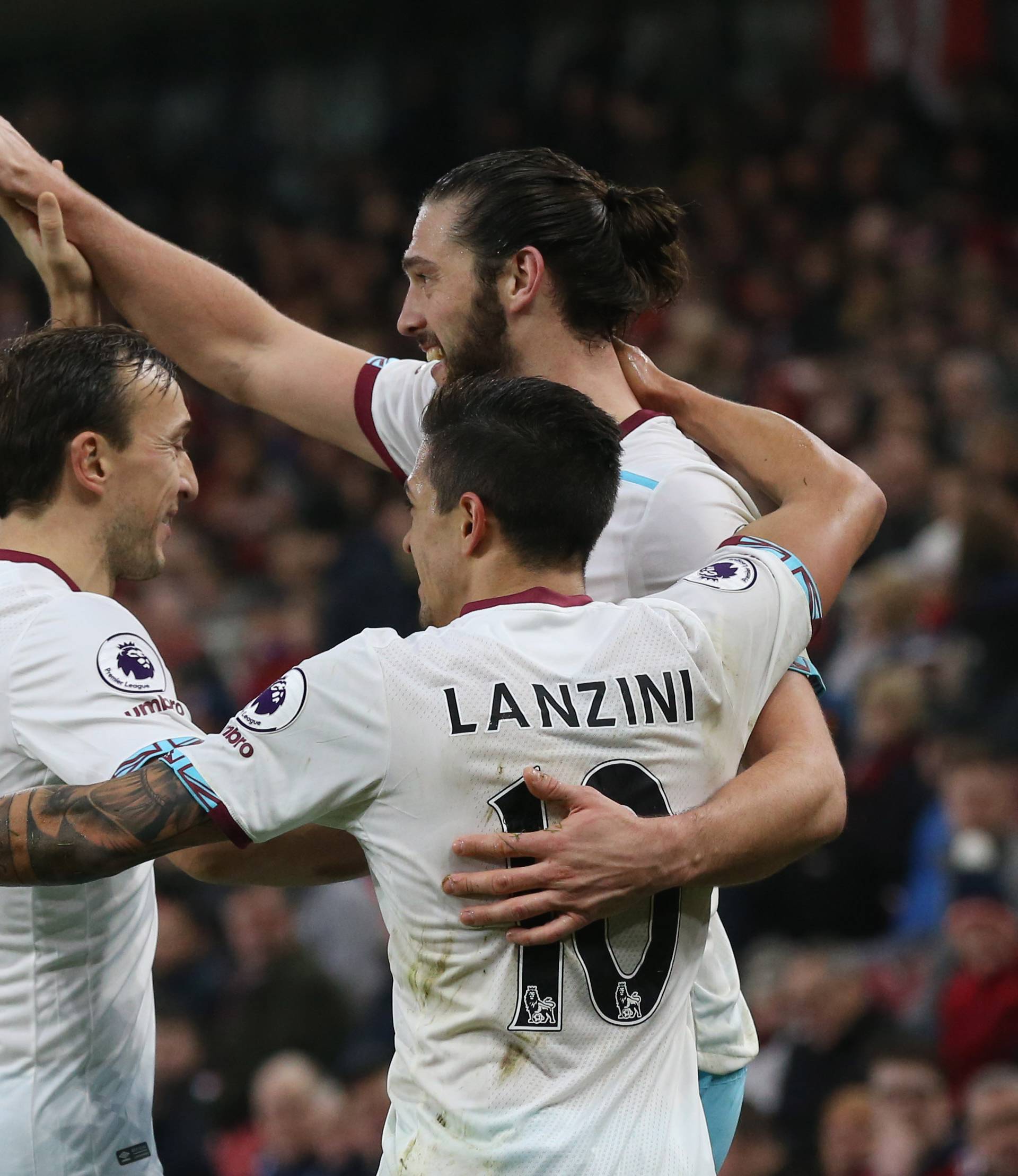 West Ham United's Andy Carroll celebrates scoring their second goal with Mark Noble and Manuel Lanzini