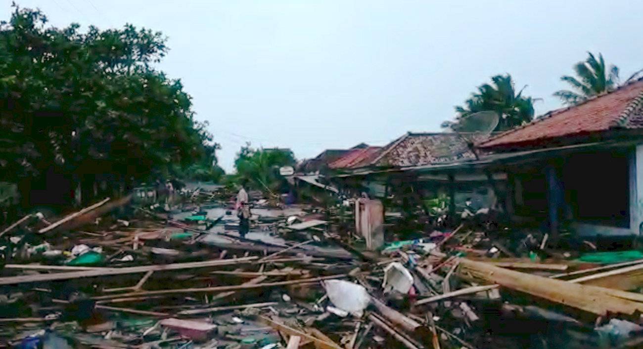 Debris is seen on the street after a tsunami hit at Lampung province