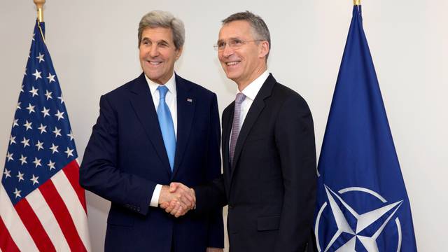 U.S. Secretary of State Kerry and NATO Secretary-General Stoltenberg pose during a NATO foreign ministers meeting in Brussels