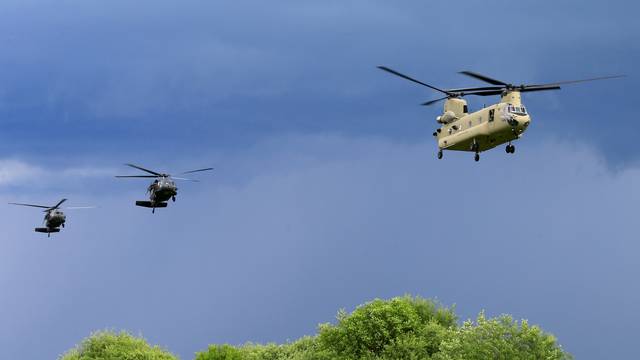 FILE PHOTO: U.S. CH-47 Chinook and Black Hawk helicopters take part in Suwalki gap defence exercise in Mikyciai