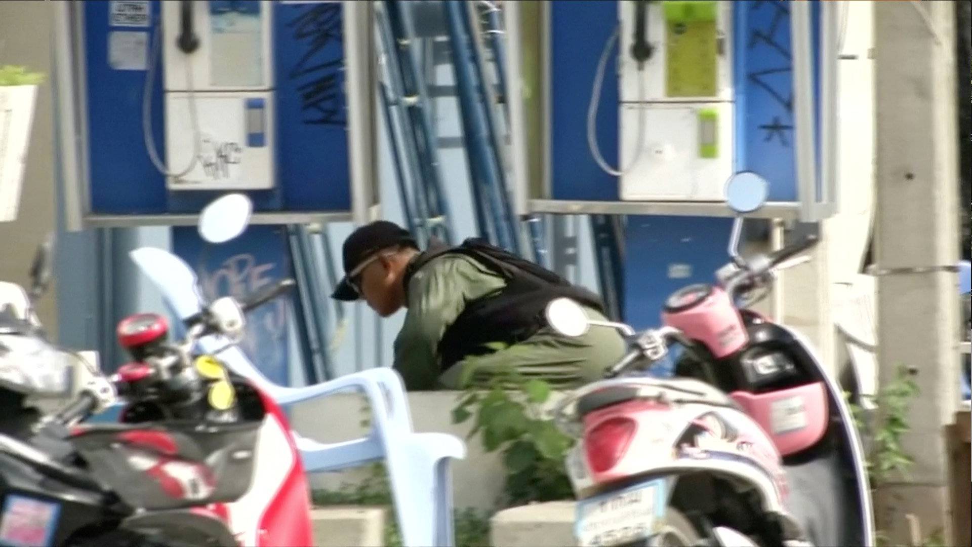 Explosive Ordnance Disposal (EOD) official checks at the scene of a bomb blast in Hua Hin