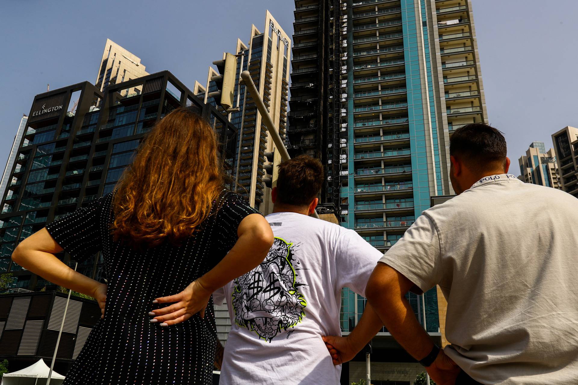 Fire damage is visible on the 8 Boulevard Walk high-rise building located near Burj Khalifa in Dubai