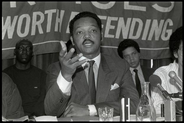 FILE PHOTO: Black American civil rights leader Jesse Jackson speaking at a news conference in London where he made an unscheduled stopover due to an airplane fault en route to tour of southern African nations.