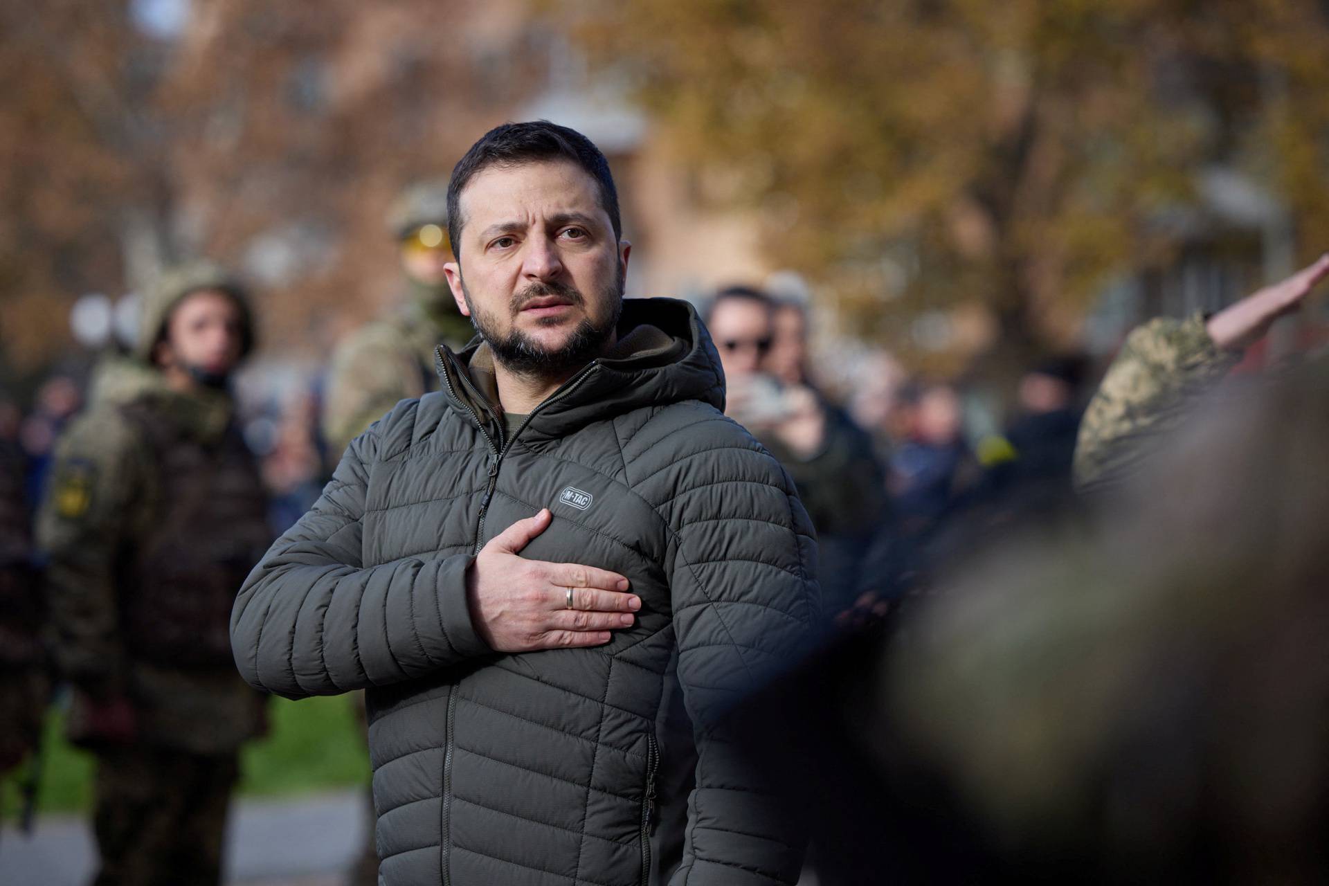 Ukraine's President Volodymyr Zelenskiy sings the national anthem during his visit in Kherson