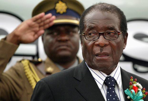 FILE PHOTO: File photo of Zimbabwe President Mugabe attending the launch of basic commodities in Harare