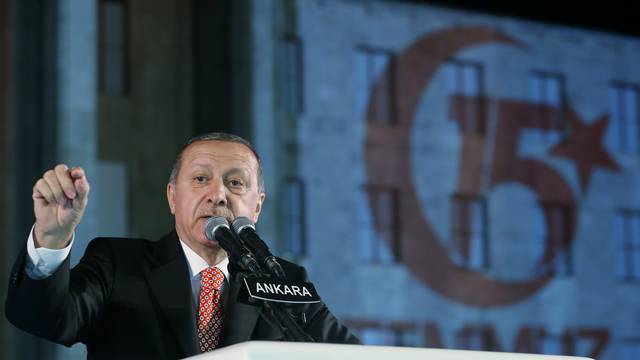 Turkish President Tayyip Erdogan makes a speech during a ceremony marking the first anniversary of the attempted coup at the Parliament in Ankara