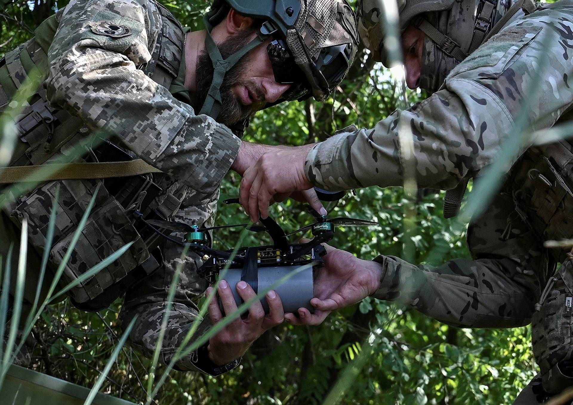 FILE PHOTO: Ukrainian servicemen prepare to launch a FPV drone near a frontline in Zaporizhzhia region