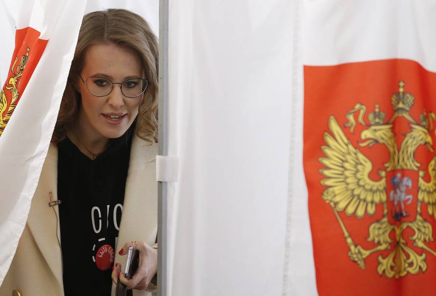 Presidential candidate Sobchak visits a polling station during the presidential election in Moscow