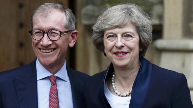 Theresa May emerges with her husband Philip to speak to reporters after being confirmed as the leader of the Conservative Party and Britain's next Prime Minister  outside the Houses of Parliament in Westminster, central London