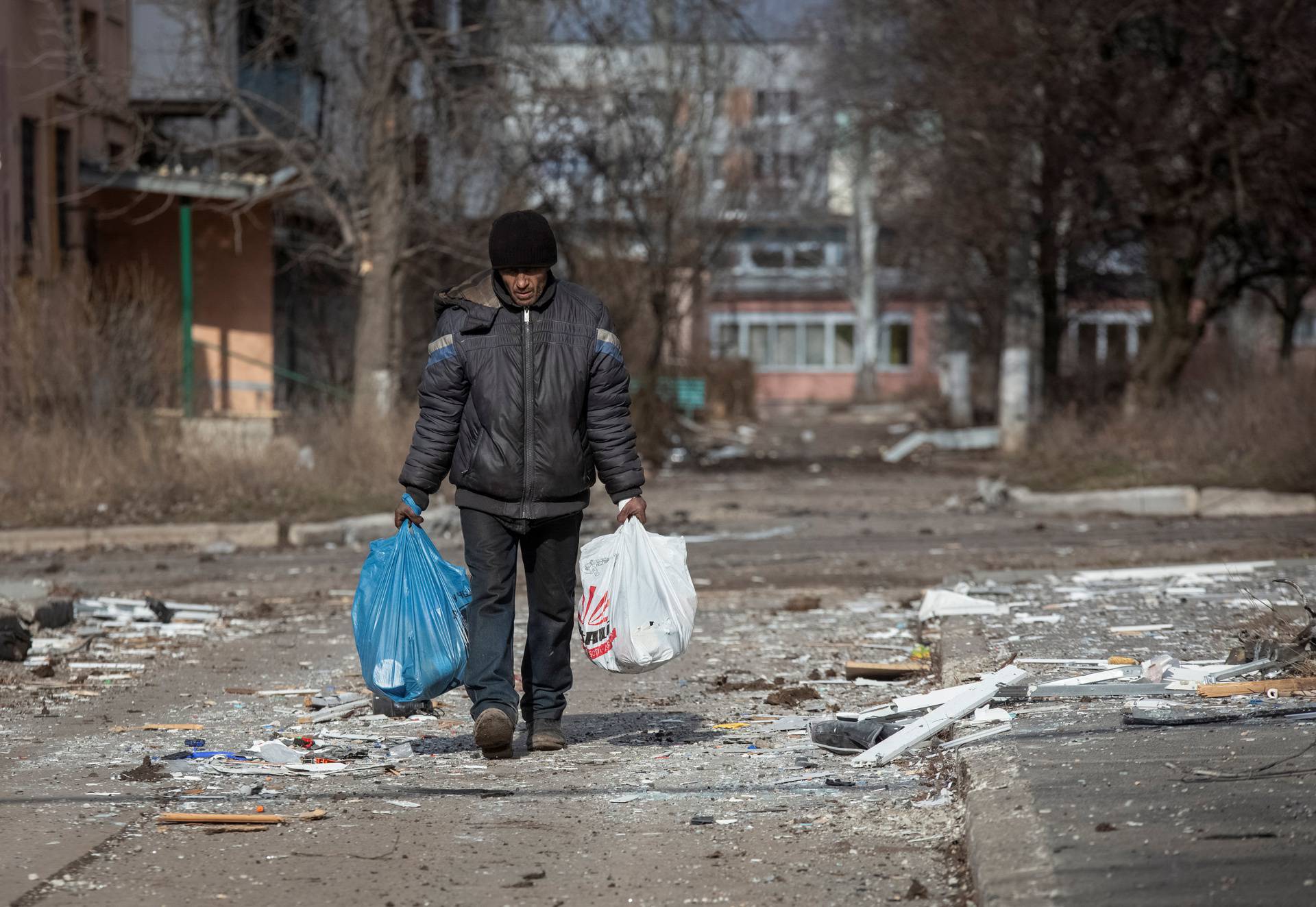 A local resident walks on an empty street in Bakhmut