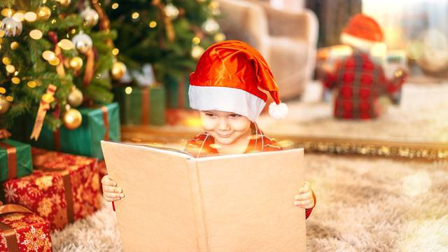 A,Happy,Child,On,The,Background,Of,A,Christmas,Tree