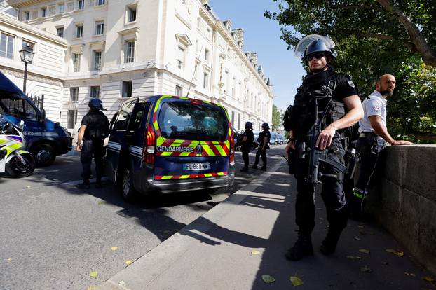 French police forces are seen near the Paris courthouse on the Ile de la Cite in Paris