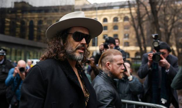 British actor and comedian Russell Brand walks outside Southwark Crown Court in London