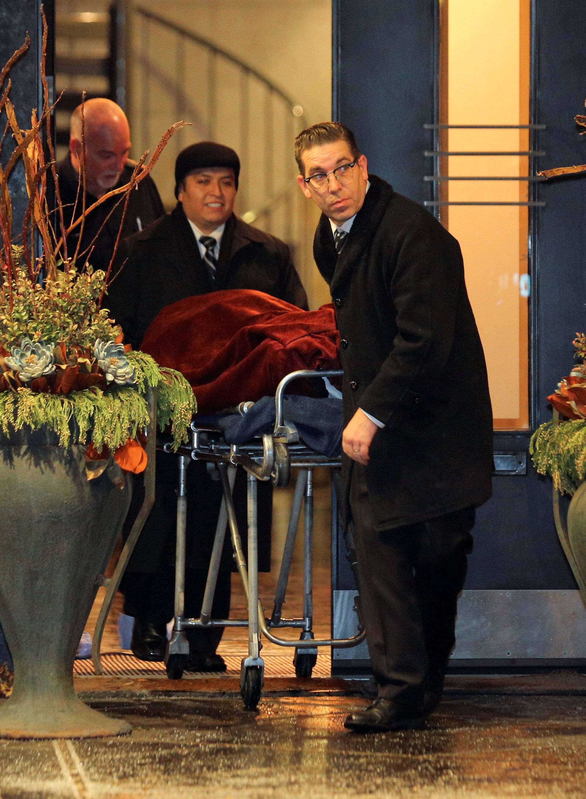 One of two bodies is removed from the home of billionaire founder of Canadian pharmaceutical firm Apotex in Toronto