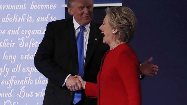 Republican U.S. presidential nominee Donald Trump shakes hands with Democratic U.S. presidential nominee Hillary Clinton at the conclusion of their first presidential debate at Hofstra University in Hempstead