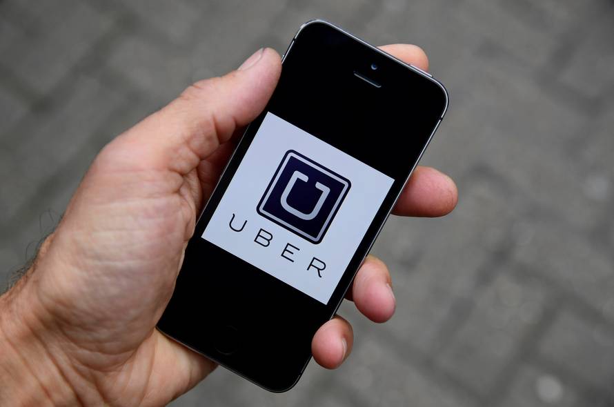 FILE PHOTO: The Uber app logo is seen on a mobile telephone