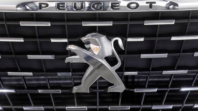 A logo of Peugeot car is seen during International Motor Show in Riga