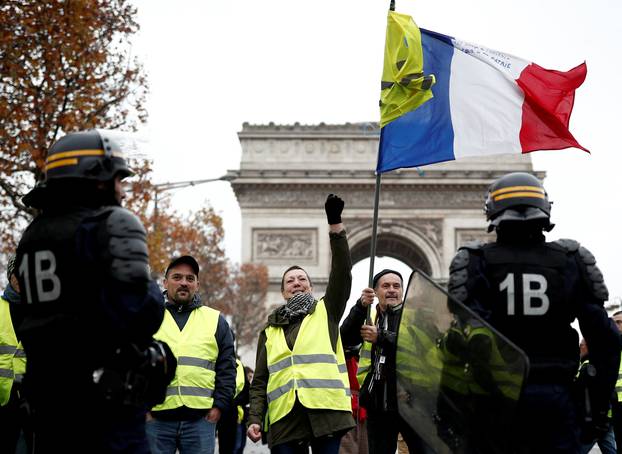 Protesters wearing yellow vests, a symbol of a French drivers
