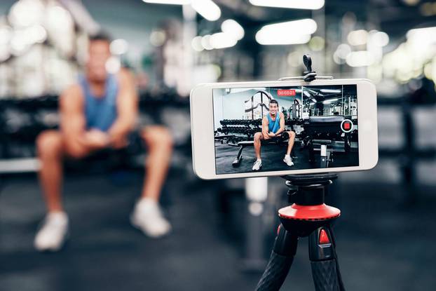 Gym,,Social,Media,And,Fitness,Influencer,With,Phone,Live,Streaming