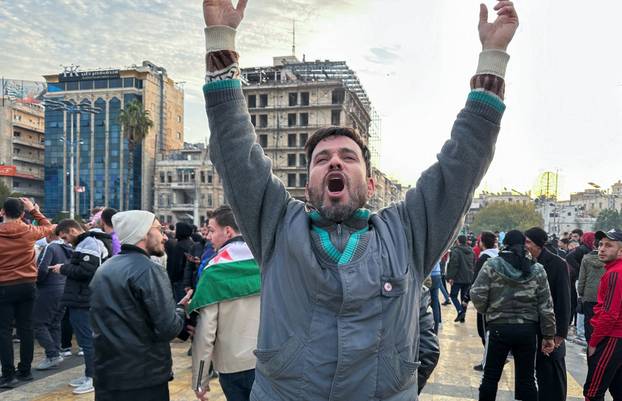 A man gestures at Saadallah al-Jabiri Square