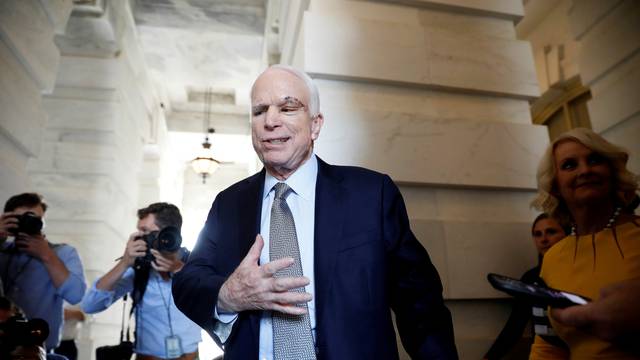 Senator John McCain (R-AZ), recently diagnosed with an aggressive form of brain cancer, departs after returning to the Senate to vote on health care legislation on Capitol Hill in Washington