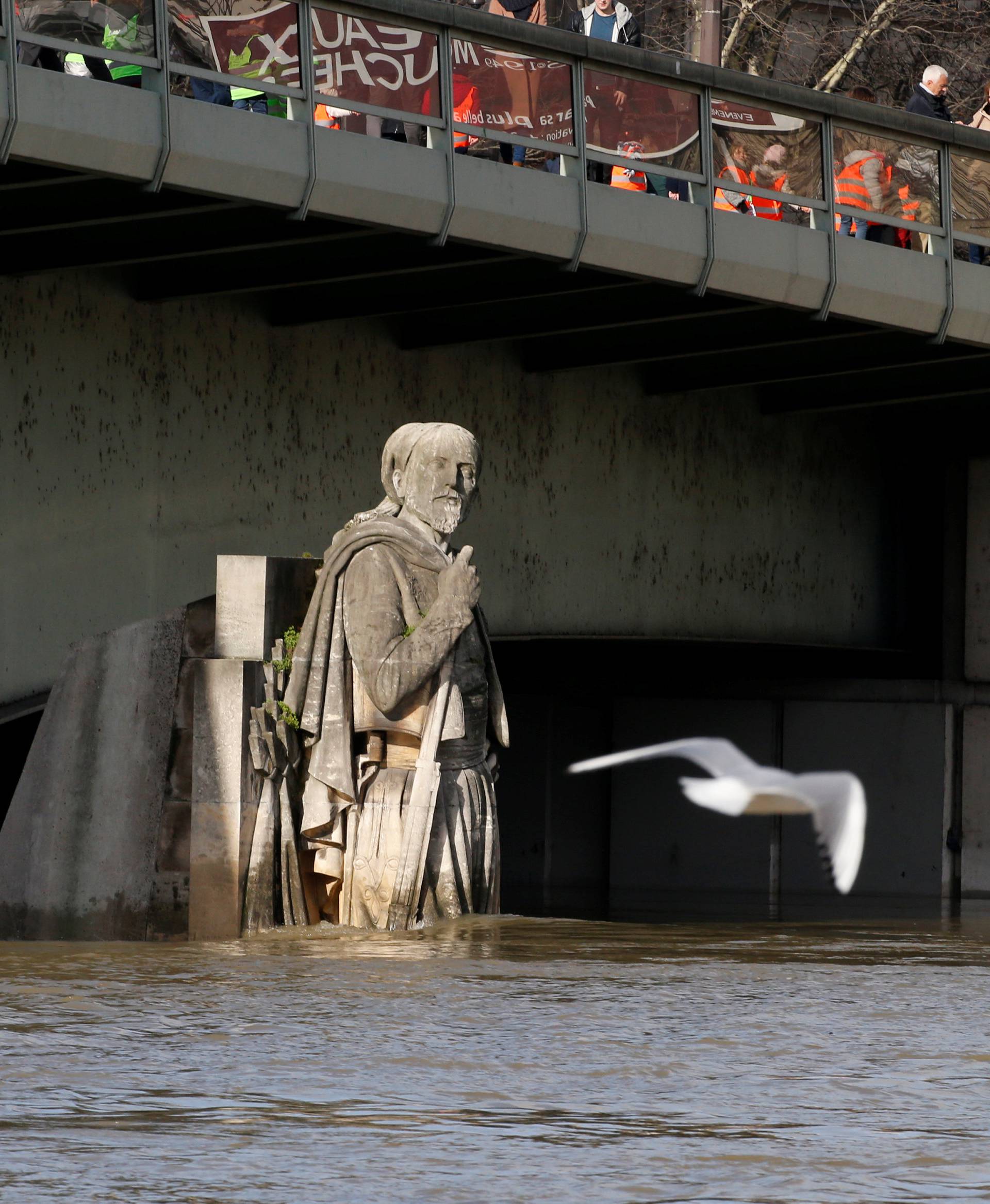 A view shows the Zouave soldier statue under the Pont d'Alma as the Seine River overflows its banks as heavy rains throughout the country have caused flooding, in Paris