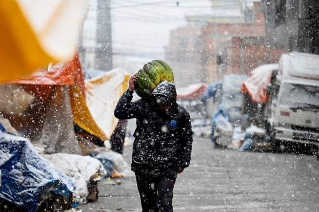 Snow falls amid low temperatures in Bolivia, in El Alto