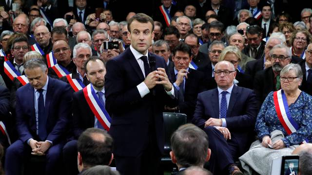 French President Emmanuel Macron attends a meeting with mayors from rural Normandy as part of the launching of the "Great National Debate" in Grand Bourgtheroulde