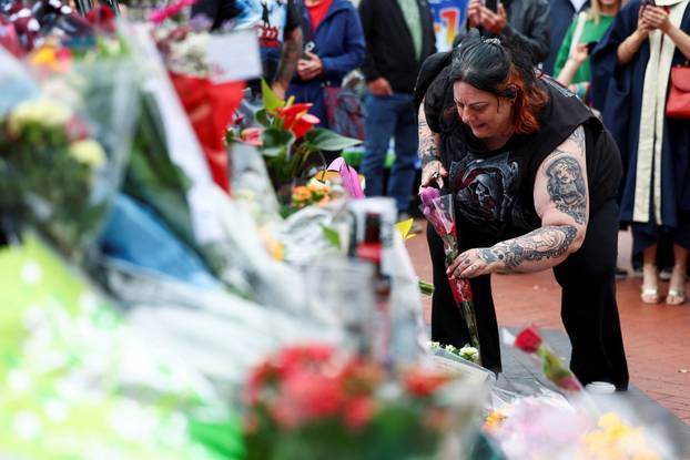Fans pay tribute following the death of Ozzy Osbourne, in Birmingham