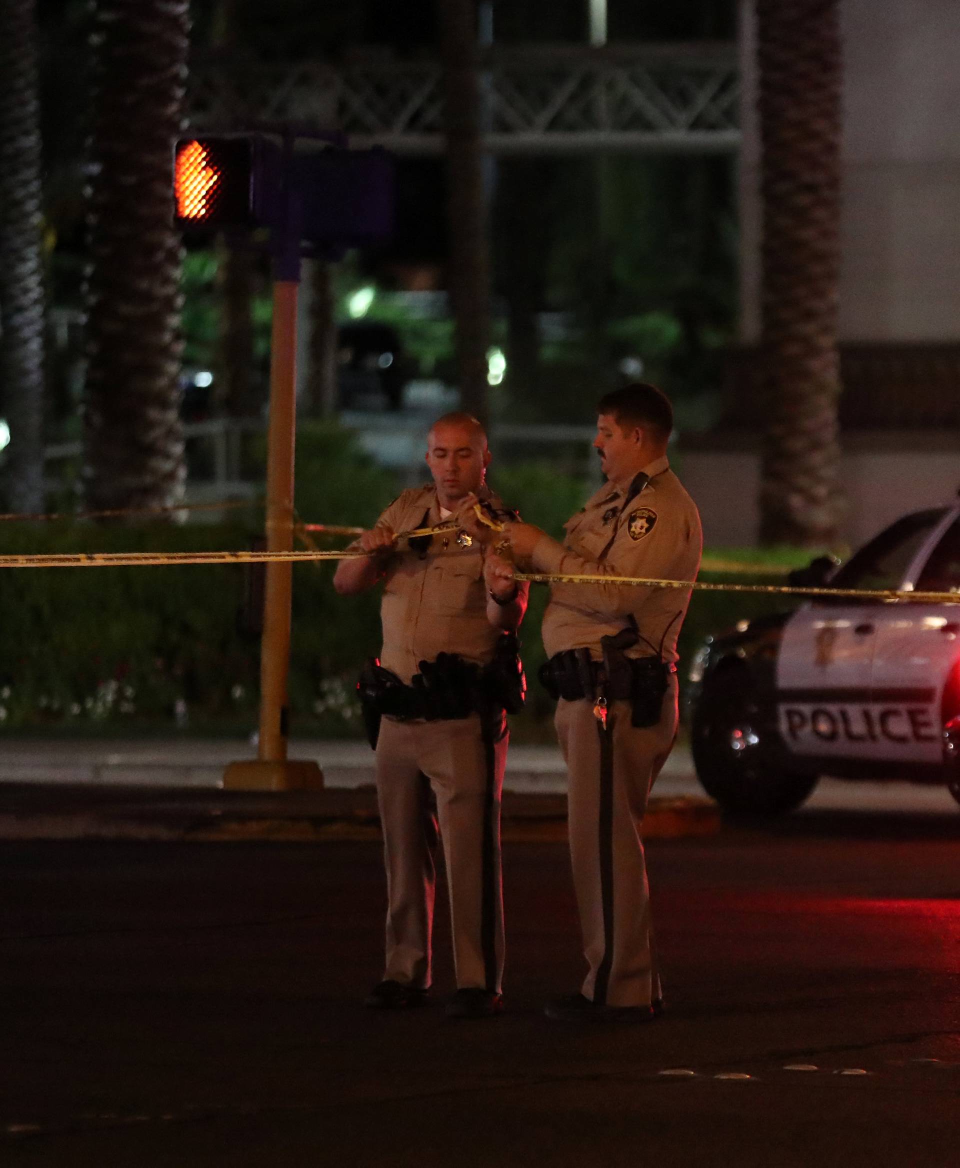 Police continue to keep a section of Las Vegas Boulevard closed as they work the crime scene following a mass shooing att he Route 91 Harvest Country Music Festival in Las Vegas, Nevada