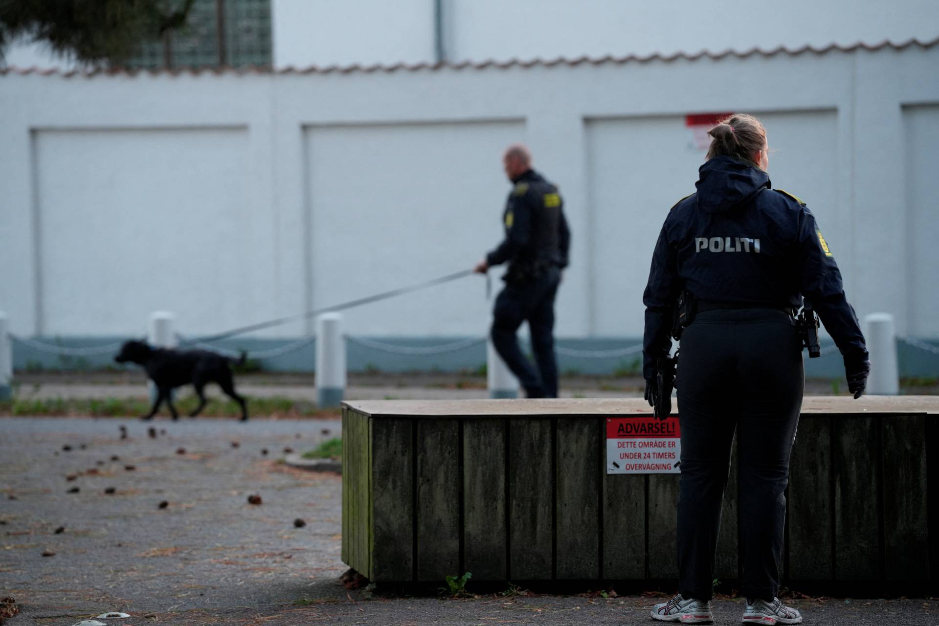 Police officers investigate two blasts near Israel's embassy in Copenhagen