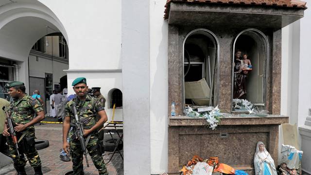Sri Lankan military officials stand guard in front of the St. Anthony's Shrine, Kochchikade church after an explosion in Colombo