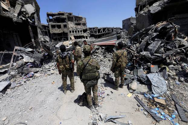 Members of the Emergency Response Division are seen in the Old City of Mosul
