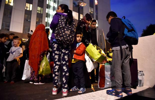 Residents are evacuated from the Taplow Tower residential block as a precautionary measure following concerns over the type of cladding used on the outside of the building on the Chalcots Estate in north London