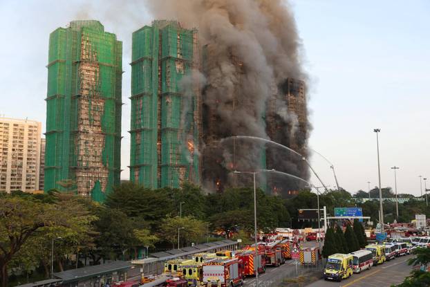 Flames engulf bamboo scaffolding across multiple buildings at Wang Fuk Court housing estate, in Tai Po