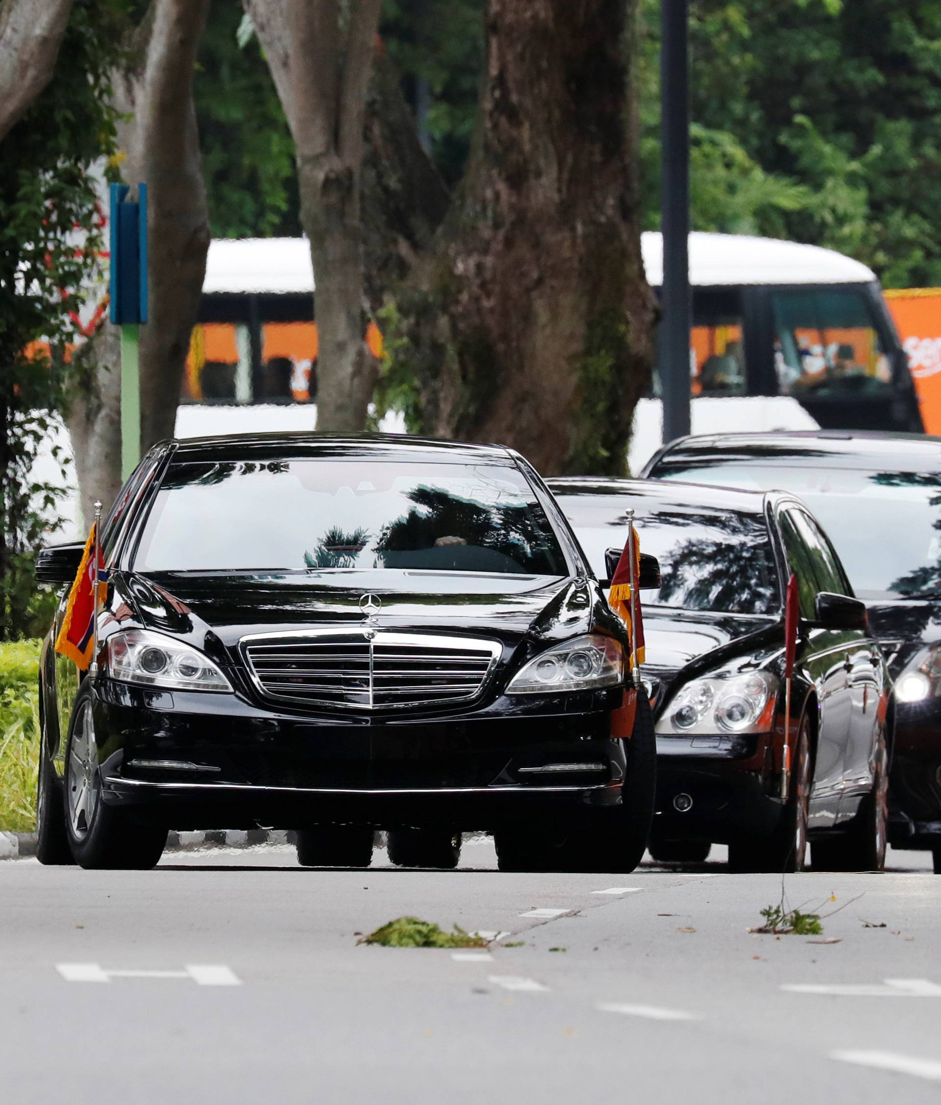 The motorcade of North Korea's leader Kim Jong Un arrives at the Capella hotel, the venue of the summit between North Korea and the U.S., on Sentosa island in Singapore