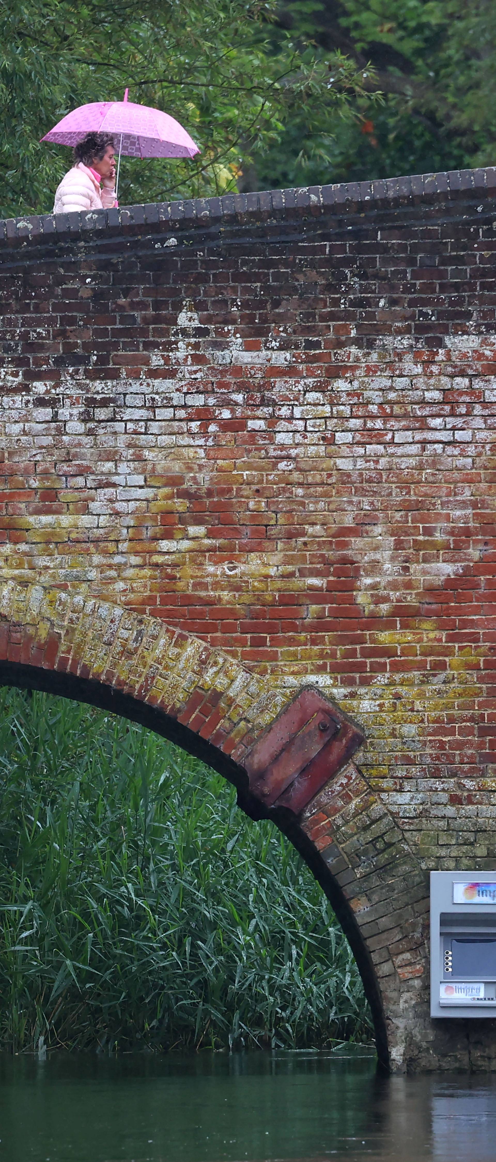 Art installation of an ATM cashpoint, attributed to anonymous artist Impro, on Sonning Bridge in Sonning