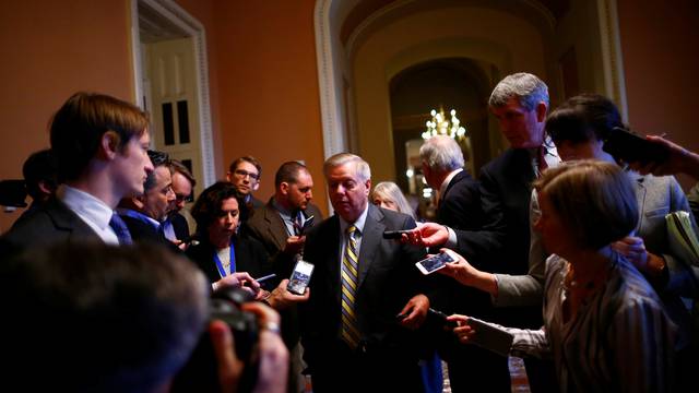 U.S. Sen. Lindsay Graham speaks to reporters outside the Senate chamber on Capitol Hill in Washington