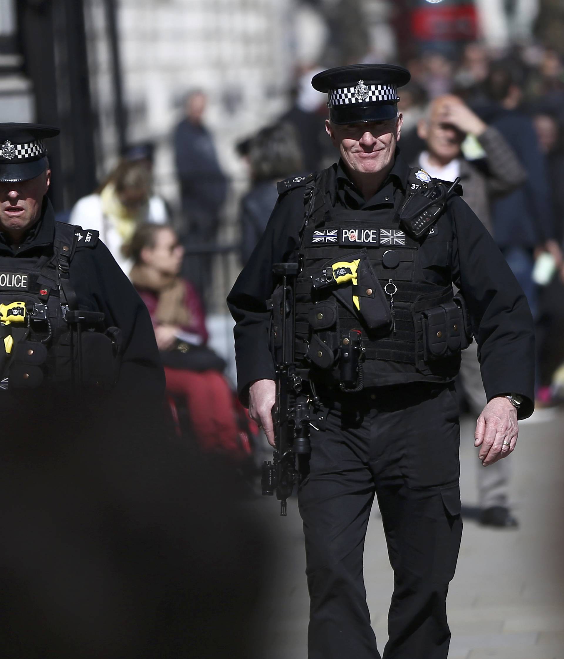 Armed police patrol the streets following the attack in Westminster earlier in the week, in central London