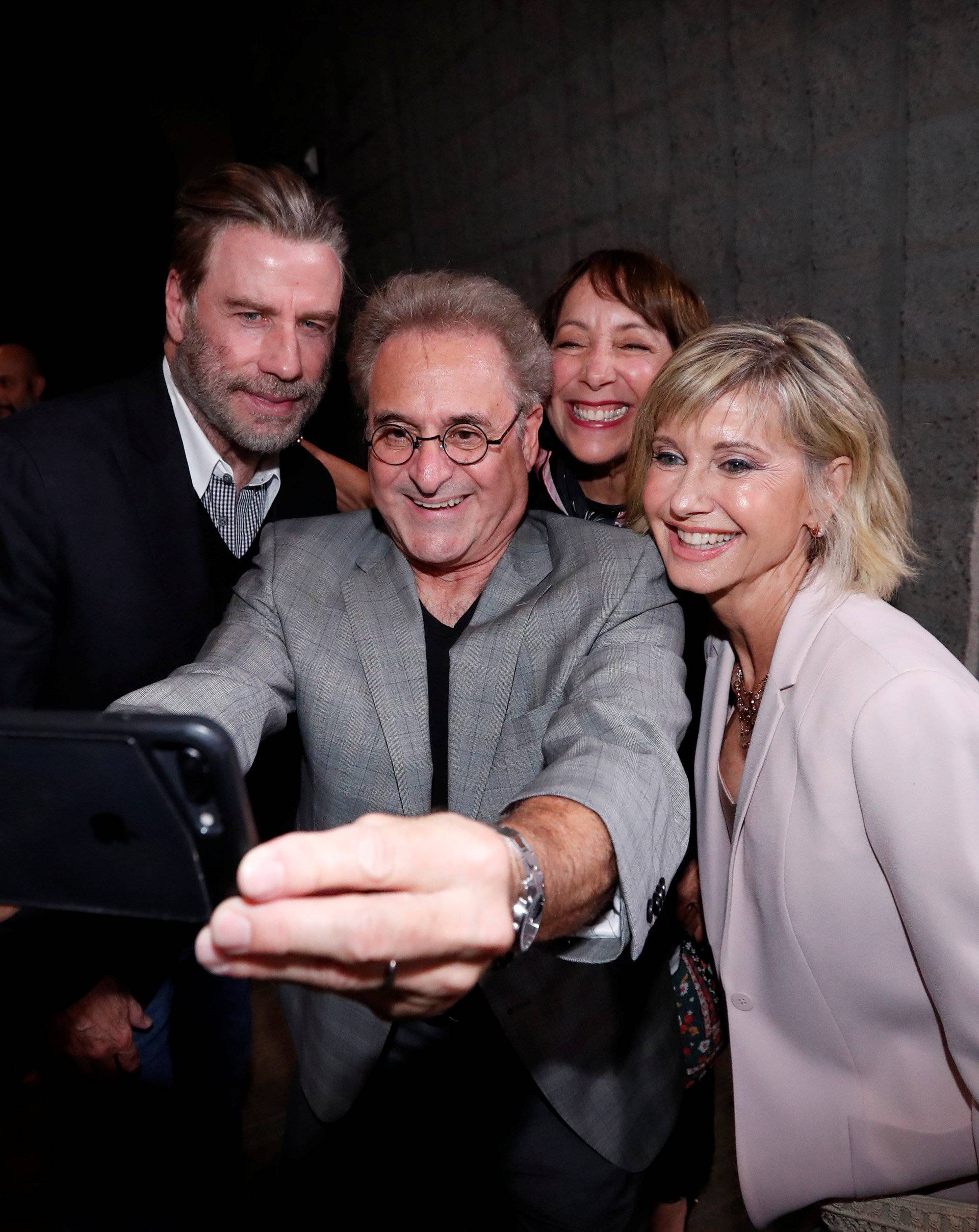 Cast members Travolta, Pearl, Conn and Newton-John pose for a selfie at a 40th anniversary screening of "Grease" at the Academy of Motion Picture Arts and Sciences in Beverly Hills