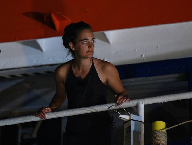 Carola Rackete, the 31-year-old Sea-Watch 3 captain, is seen onboard the ship as it docks in Lampedusa