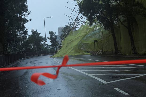 Collapsed bamboo scaffolds of a residential building are seen as Typhoon Wipha approaches, in Hong Kong