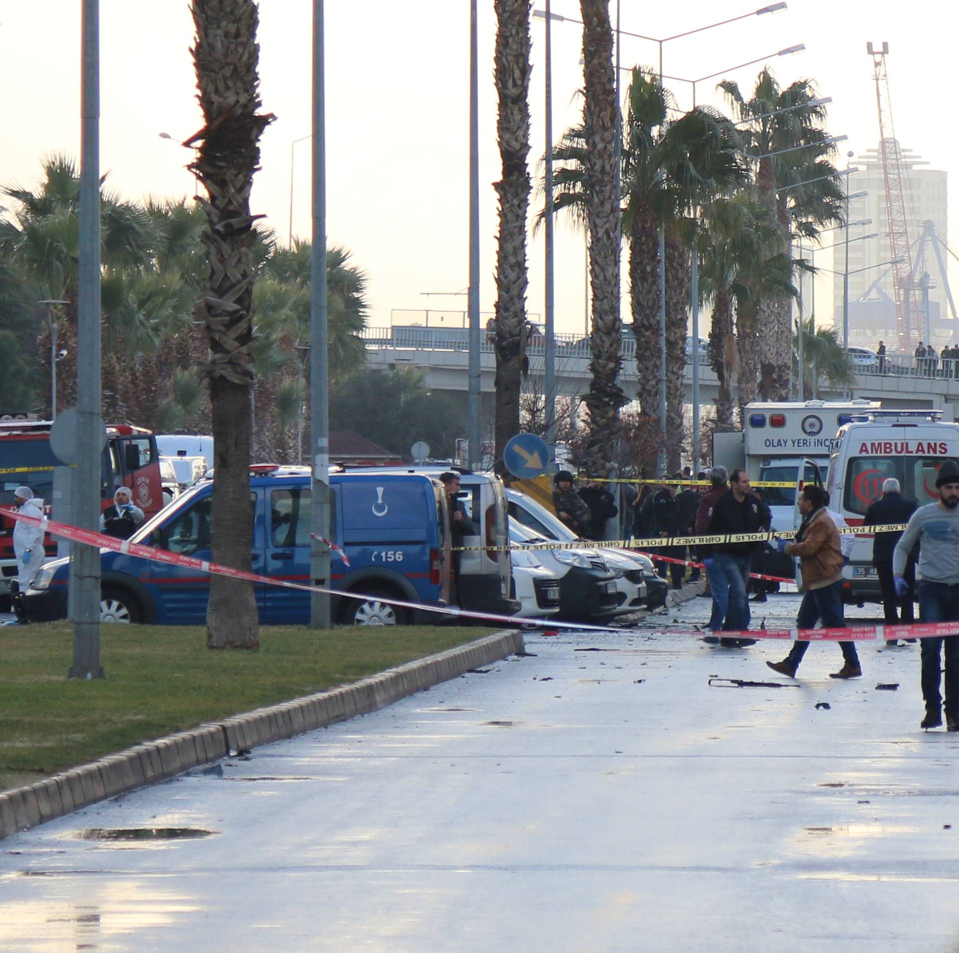Police secure the area after an explosion outside a courthouse in Izmir