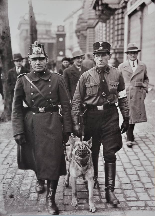 Policeman and SS man ( armband marks ) policeman patrol on the day of the Reichstag Elections March 5 1933 ( Topographie of Terror historical museum on site of former Gestapo headquarters ) Berlin Germany