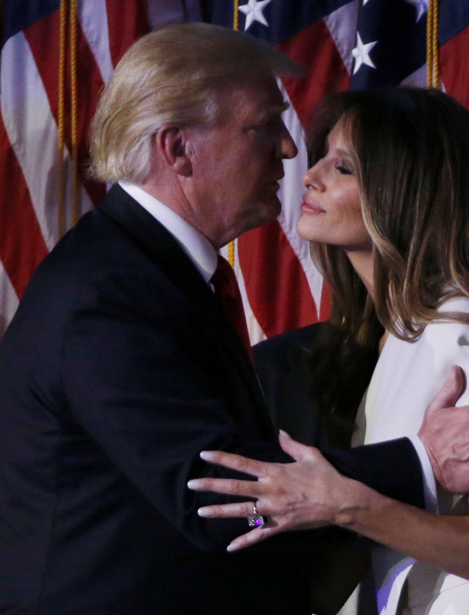 Republican U.S. President-elect Donald Trump kisses his wife Melania at his rally in New York